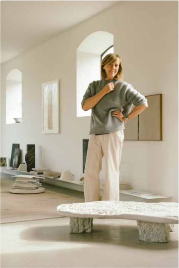 Bea Mombaers standing in her home